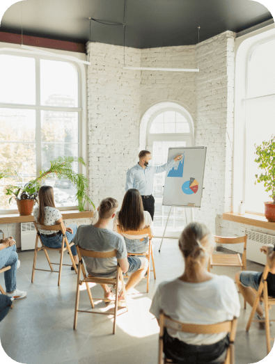 male-speaker-giving-presentation-hall-university-workshop-audience-conference-hall